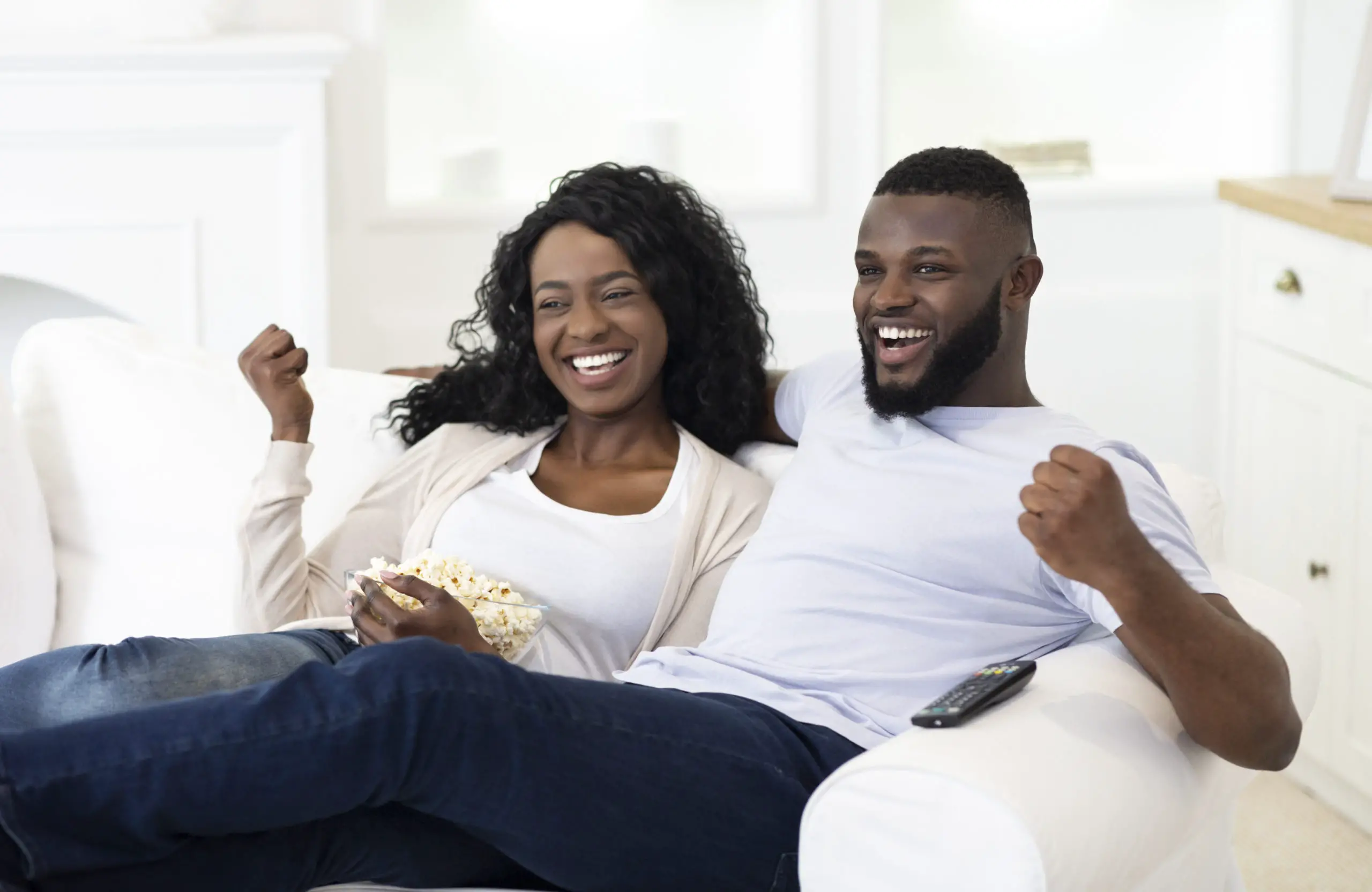 https://elements.envato.com/married-couple-watching-sport-on-tv-supporting-JAQQ5SX