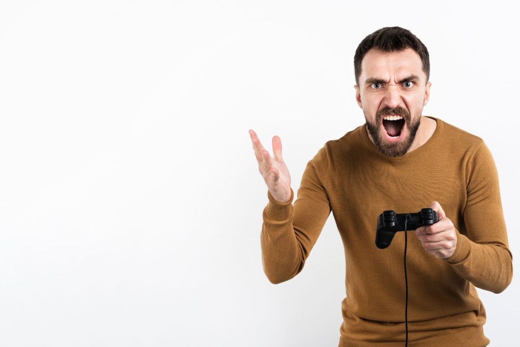 angry man holding game controller